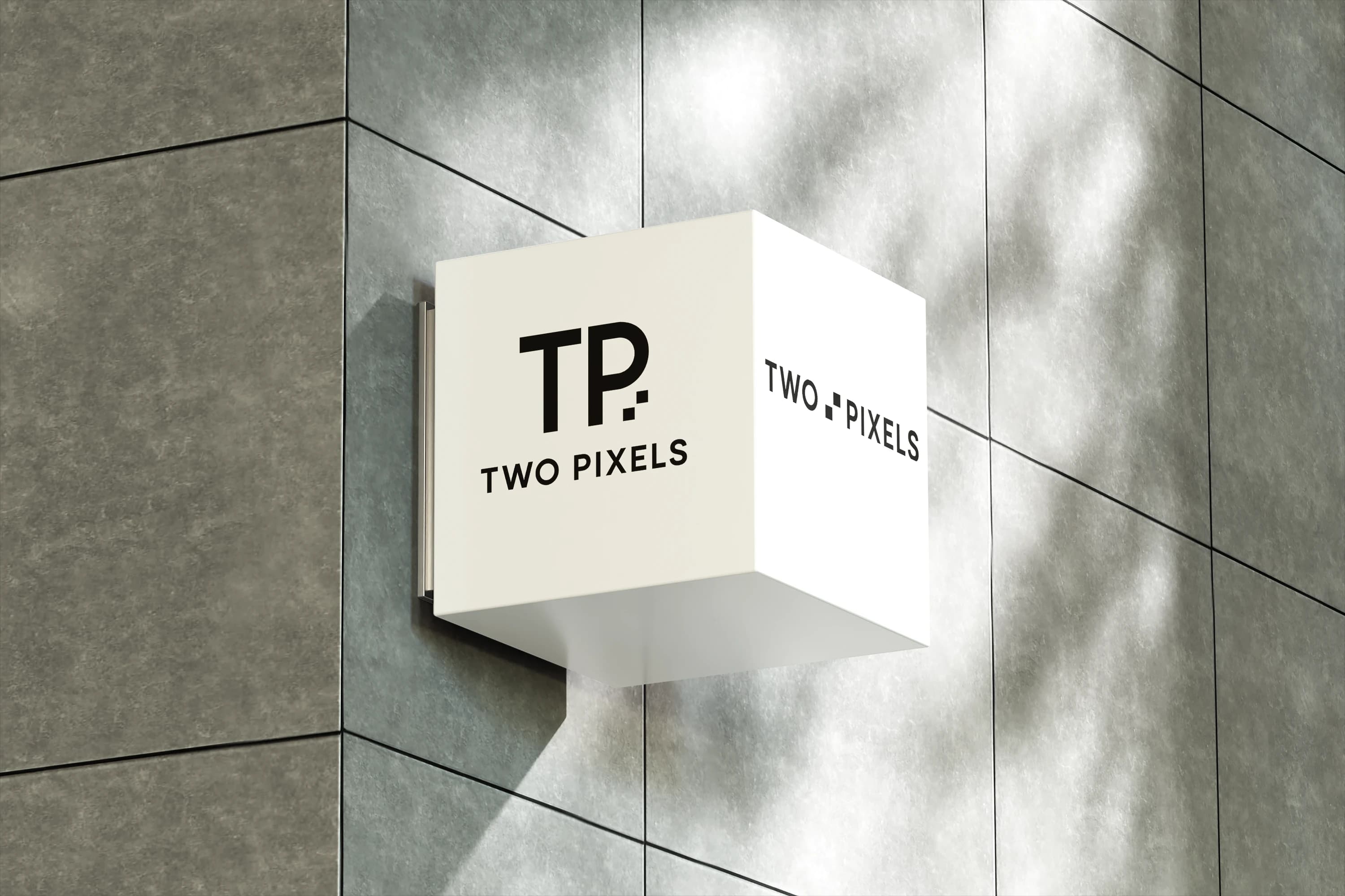 An image of square box haning off of the wall with the two pixels logo in the websites section